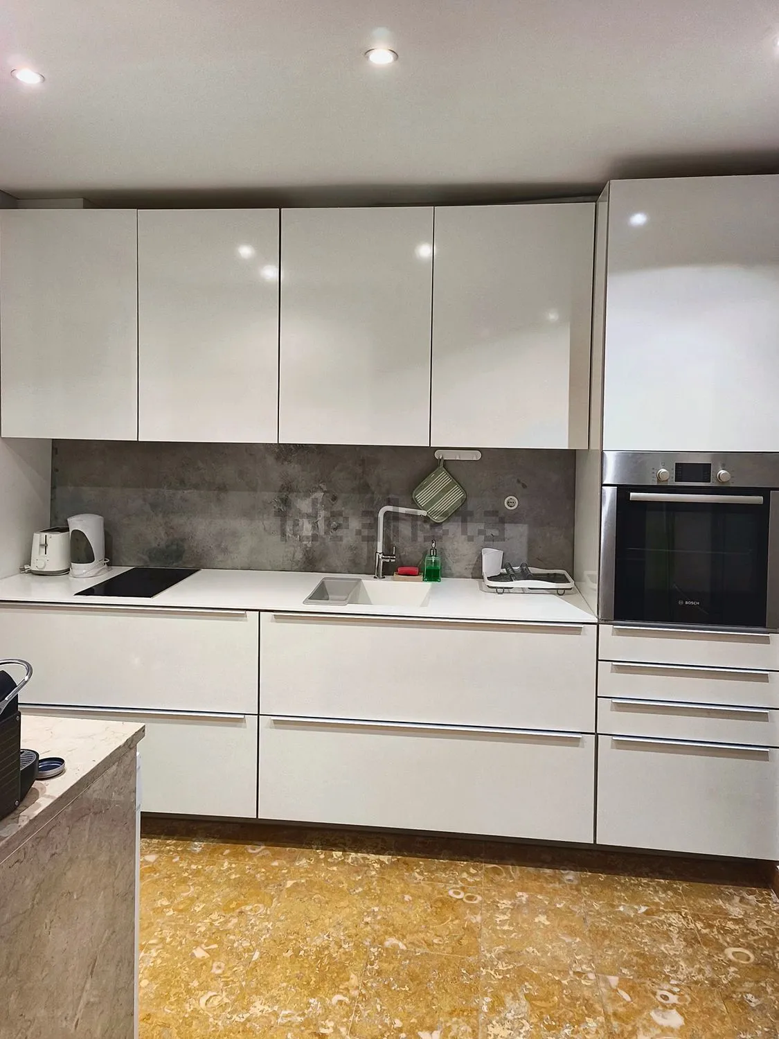 White kitchen with an induction hob