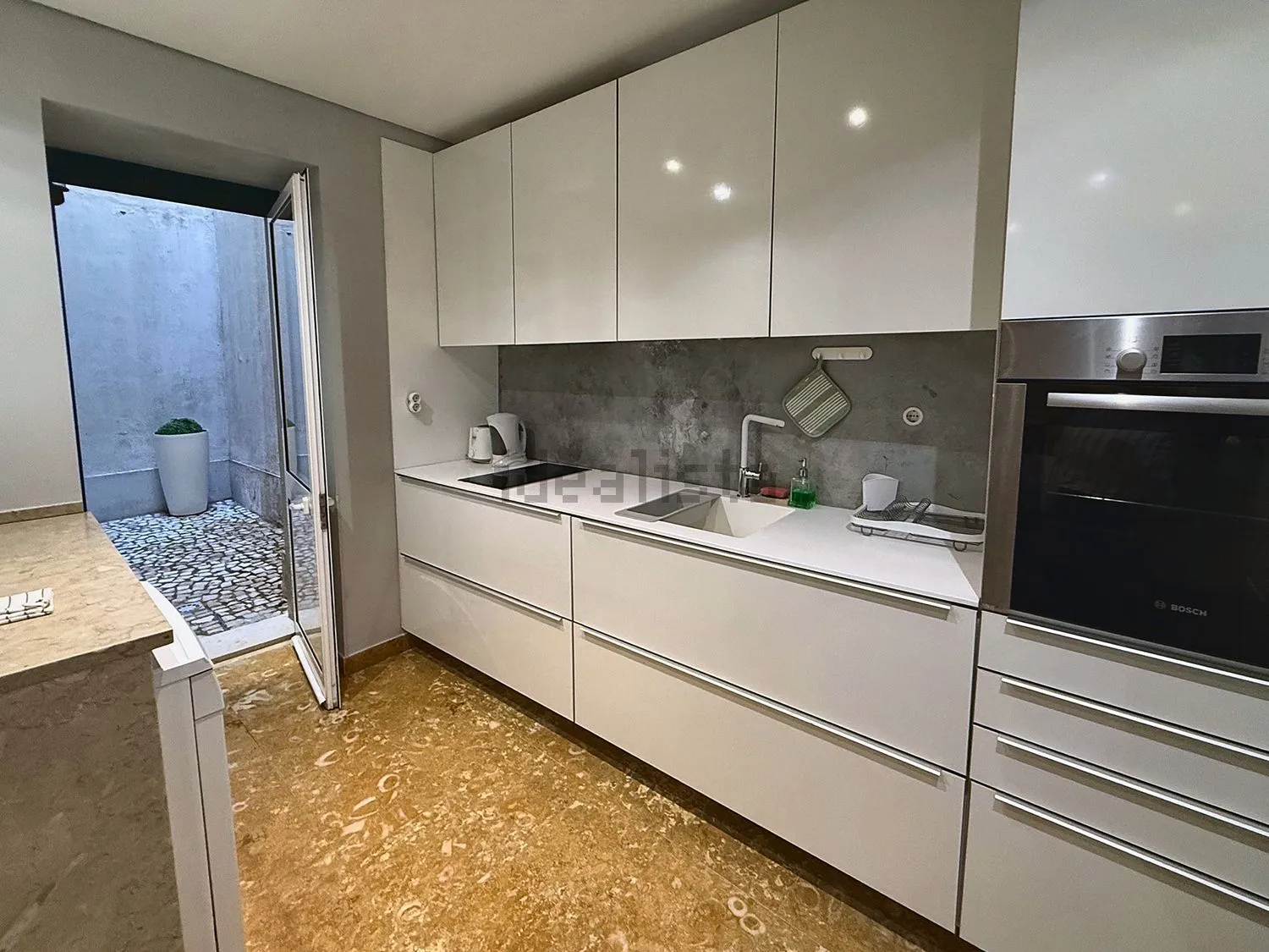Kitchen opening to the inner patio