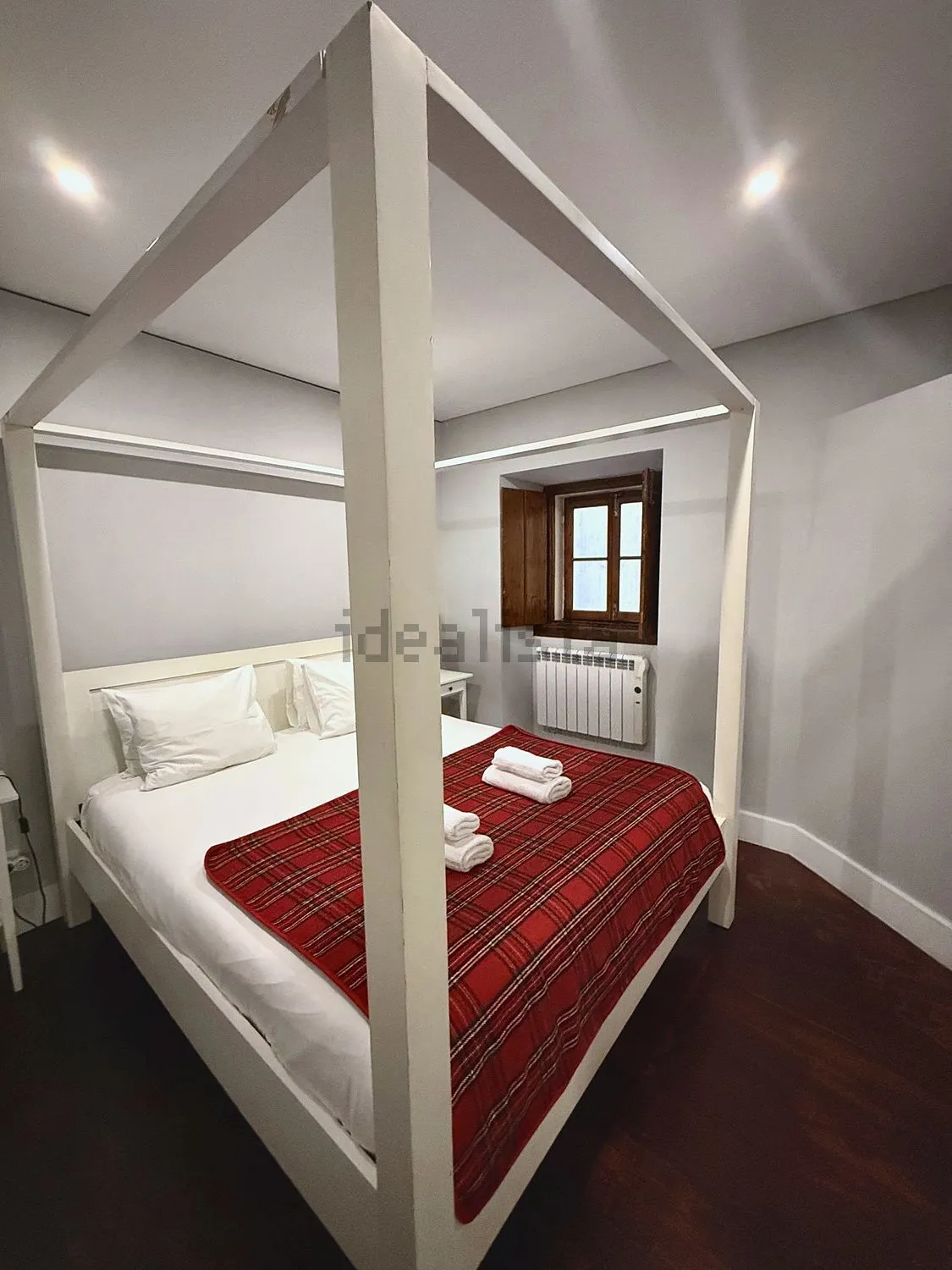 The bedroom with a four-poster bed